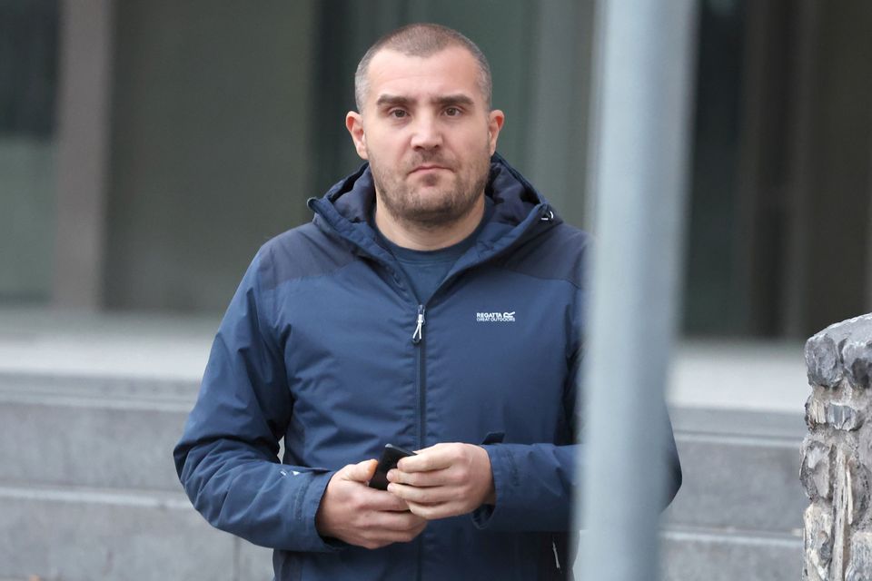 Garda George Magdelina leaving the District Court Photo: Collins Courts
