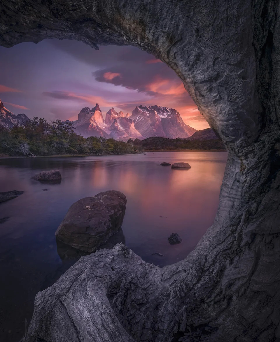 pink sunrise over a lake and mountains