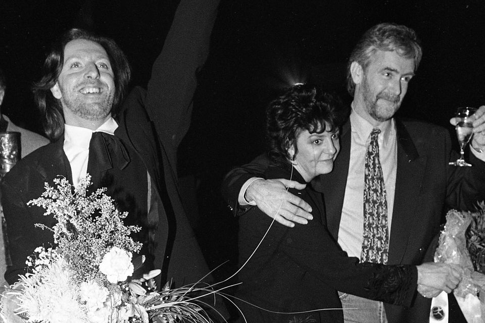 Eurovision winners Paul Harrington, left, and Charlie McGettigan with his wife Goretti in 1994. Photo: Independent Newspapers Ireland/NLI Collection