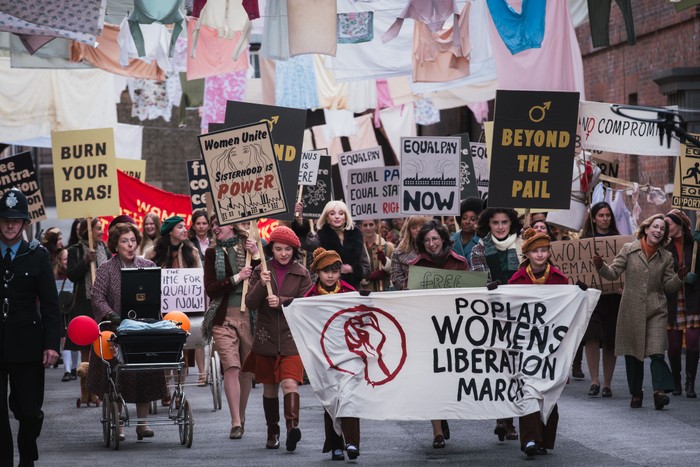 Call the Midwife season 15 episode 1 Call the Midwife characters on a Poplar women's liberation march, holding signs and placards.