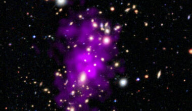 This release features a composite image of a galaxy cluster first discovered on New Year's Eve day, 2020. The cluster appears here as a large collection of brilliant white lights, each a distinct galaxy. A neon purple cloud stretches across the cluster's crowded core. Many of the hundred-plus galaxies in the cluster are in two clumps of galaxies towards the top and bottom of center. Some are encircled by a faint glowing haze, while a few foreground stars gleam with diffraction spikes. Some of the smaller galaxies are tinted blue, orange, or red, and some appear more oblong than round, suggesting spiral shapes viewed edge-on. The neon purple cloud sits at the heart of the image, surrounding the most densely-packed part of the cluster. This cloud, which spreads vertically across the cluster, is multimillion-degree gas observed by Chandra. The two clumps of observable galaxies, and the spread of superheated gas, reveal that the Champagne Cluster is in fact two clusters in the process of colliding. With the two clusters of sparkling light clinking together, and the auspicious discovery date, astronomers have dubbed the merged cosmic structure "The Champagne Cluster".