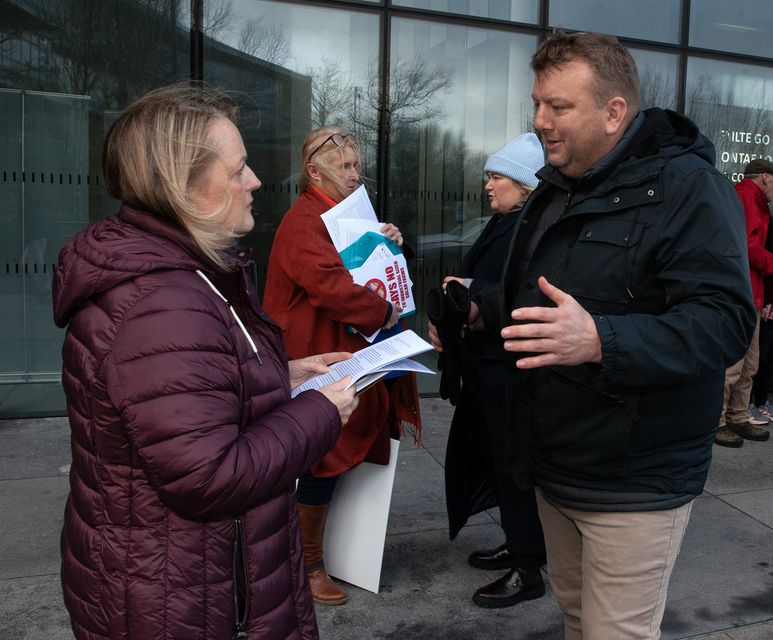 Cllr Lisa McDonald speaking with the residents spokesperson Terry Murphy at Gusserane's protest against the proposed solar development pictured outside the Wexford County Council on Monday. Pic: Jim Campbell
