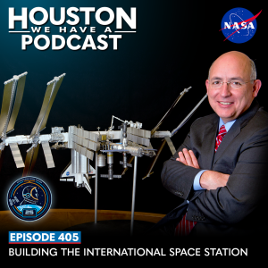Houston We Have a Podcast Episode 405: Building the International Space Station Mike Suffredini crosses his arms, standing in front of a model of the International Space Station