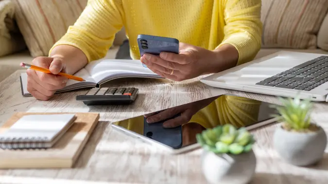 Woman Setting Financial Goals at Home. stock photo
