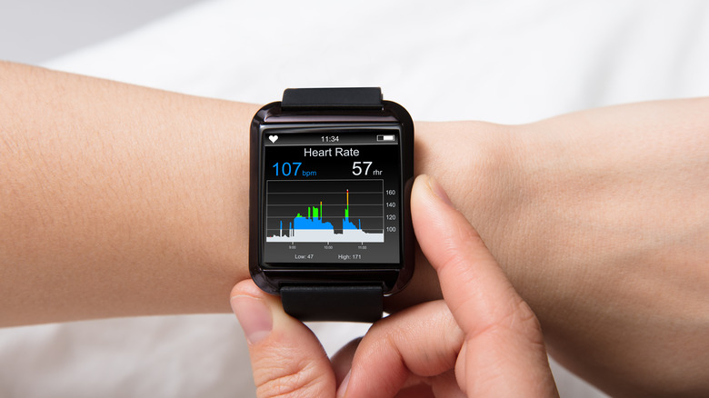 A smartwatch with health data on the screen