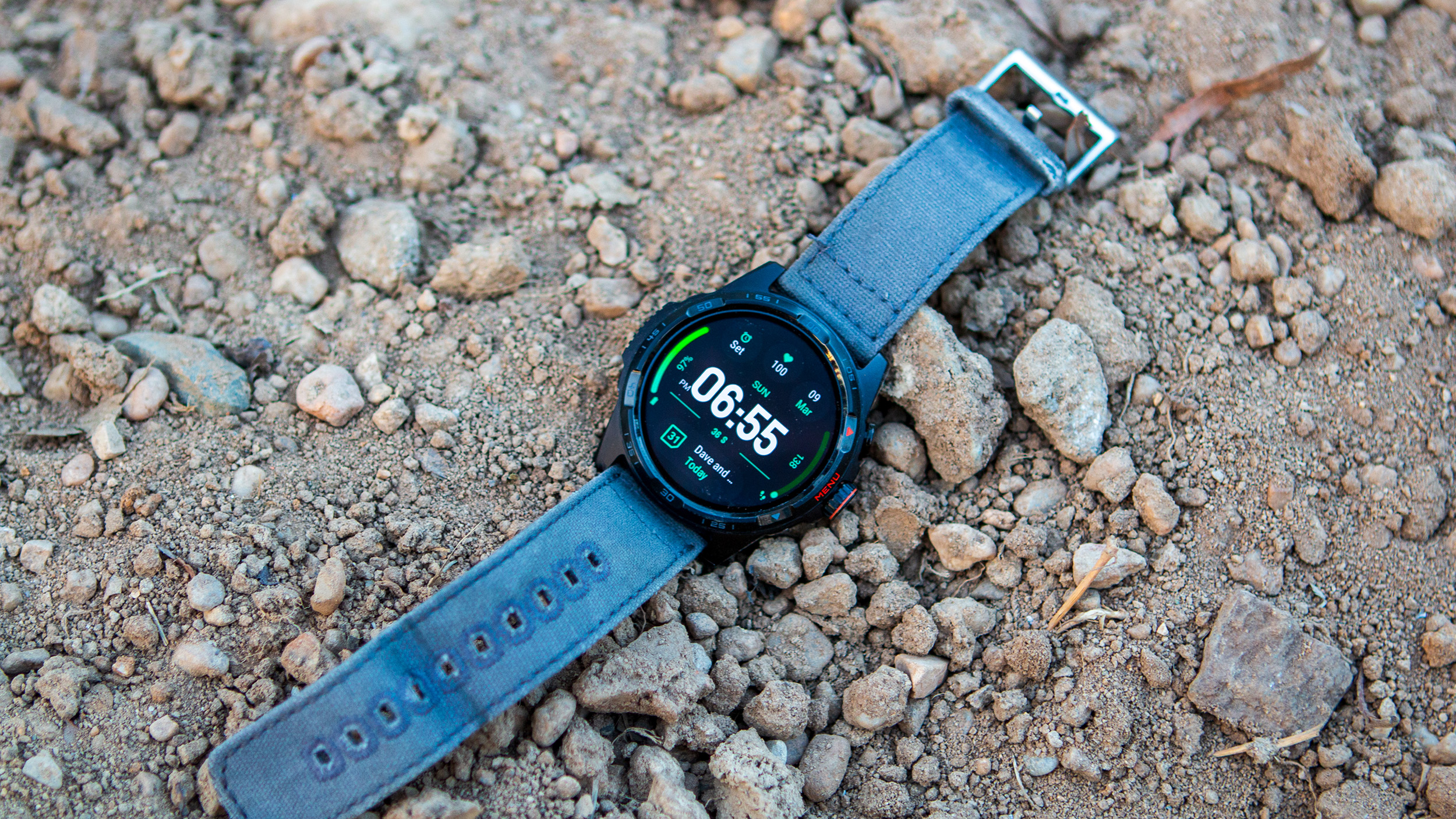 TicWatch Atlas sitting in dirt and rocks