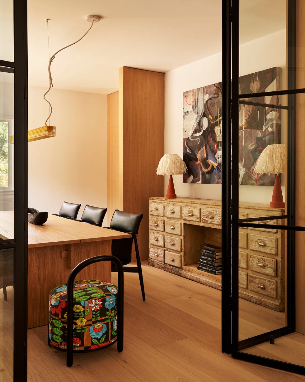 a warm dining space with lots of woods.