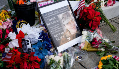 Man charged in National Guard shooting pleads not guilty to murder and assault from hospital bed