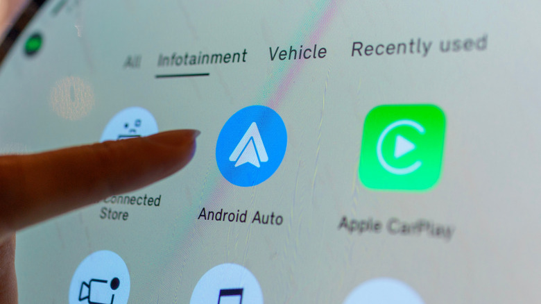 Close-up of a car's digital infotainment system showing the Android Auto icon