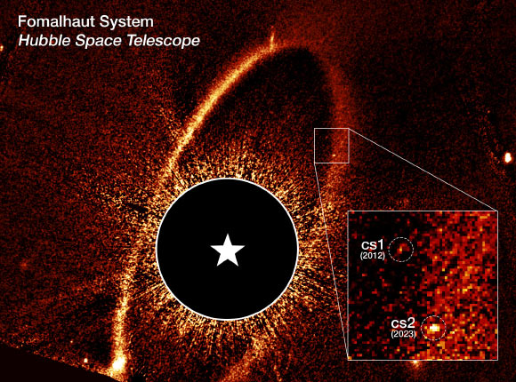 This Hubble image shows the debris ring and dust clouds cs1 and cs2 around Fomalhaut. Image credit: NASA / ESA / P. Kalas, UC Berkeley / J. DePasquale, STScI.