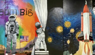 A colorful art mural representing space exploration. The words "Dream Big" appear in the upper left corner.