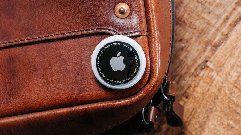 An Apple AirTag on a leather briefcase