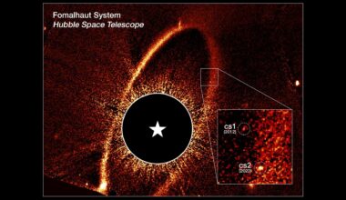 Composite image. A black circle is in the middle surrounded by a ring of yellow and orange spindles. A box inset highlights the location of the dust clouds.