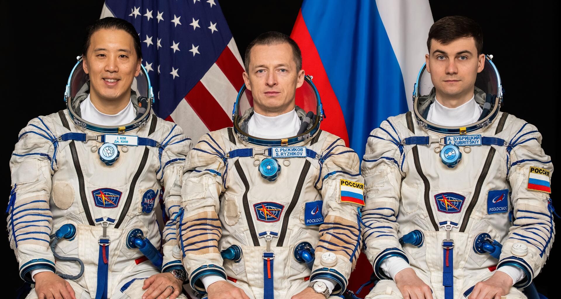 Soyuz MS-27 crew members (frm left) NASA astronaut Jonny Kim and Roscosmos cosmonauts Sergey Ryzhikov and Alexey Zubritsky pose for a portrait at the Gagarin Cosmonaut Training Center in Russia.
