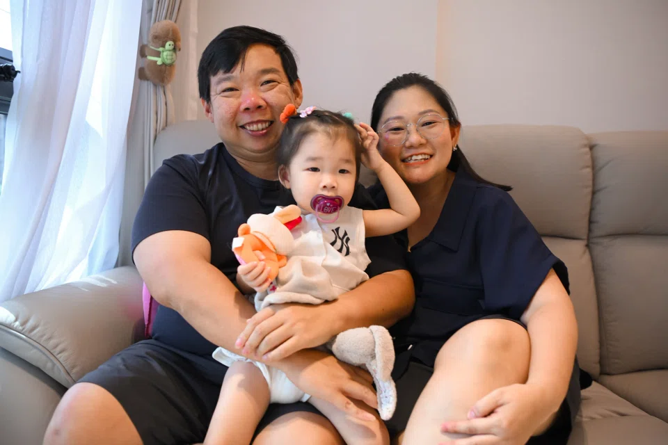 Ms Felicia Lee and her husband Cedric Ng went through two rounds of in-vitro fertilisation before they had their daughter Phoebe, now one year old. ST PHOTO: AZMI ATHNI
