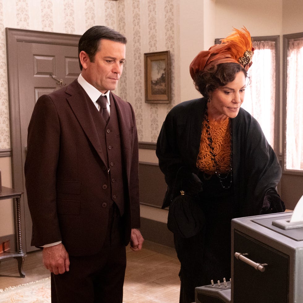 a historical scene featuring two individuals in a room a historical scene featuring two individuals in a room