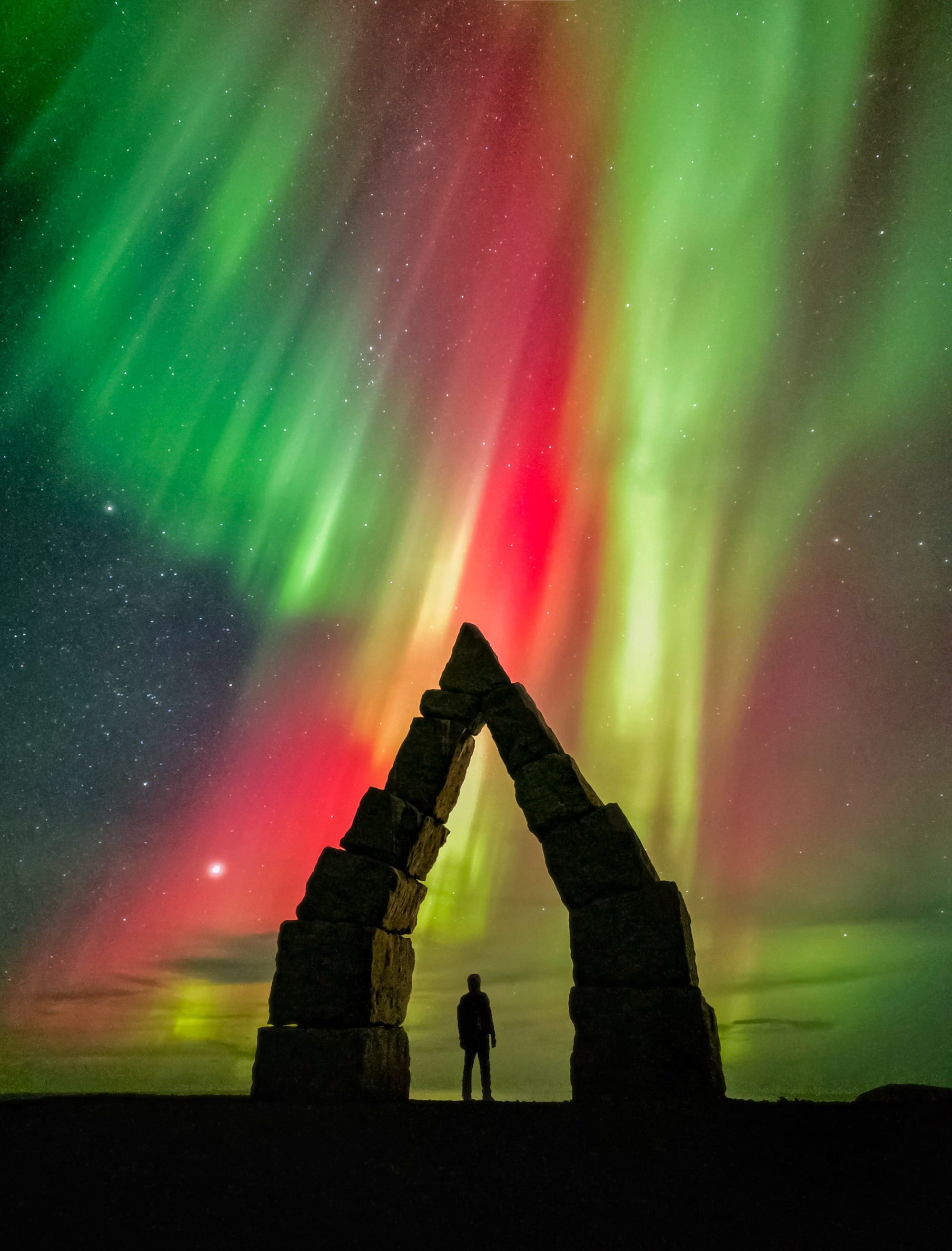 A colorful aurora borealis captured over Arctic Henge in Iceland