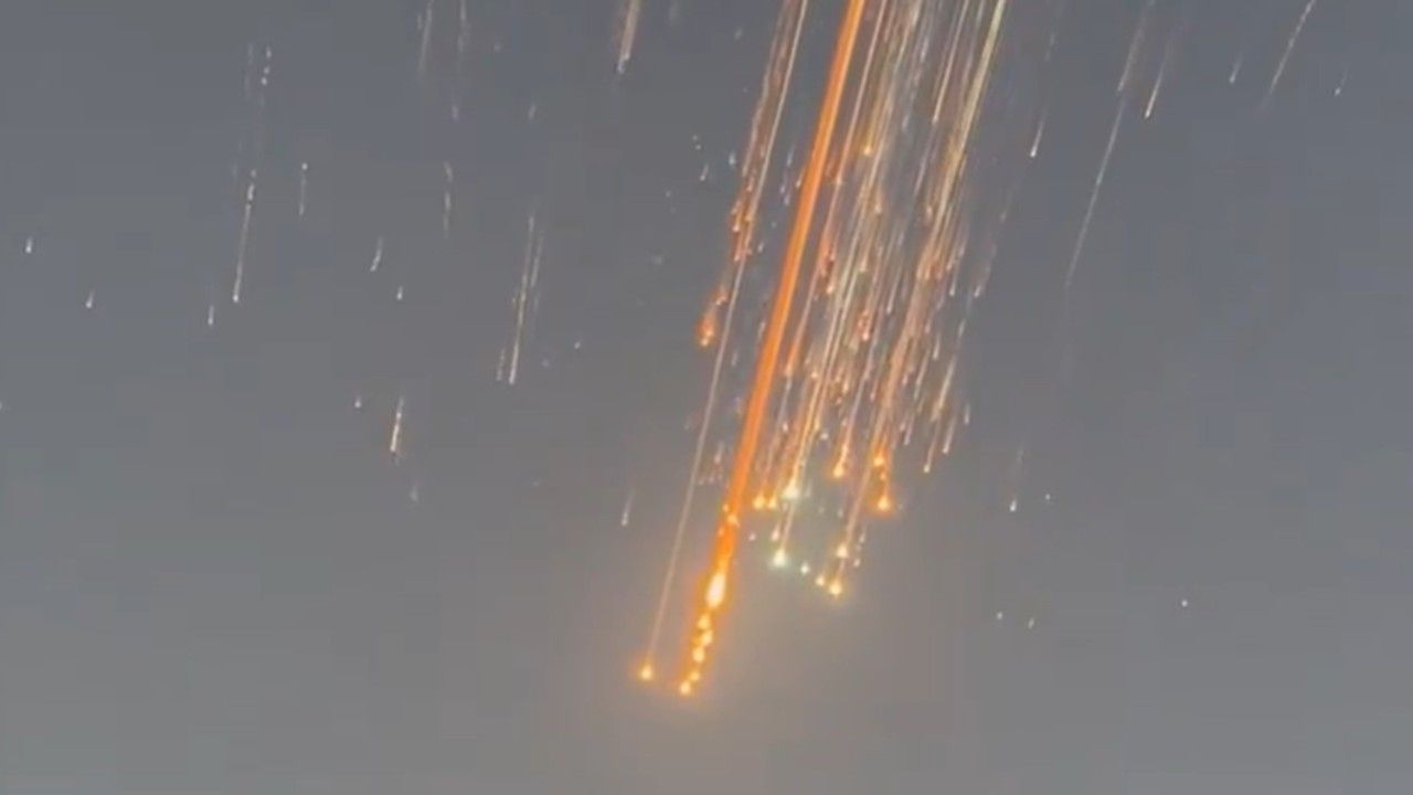 streaks of fire in the evening sky