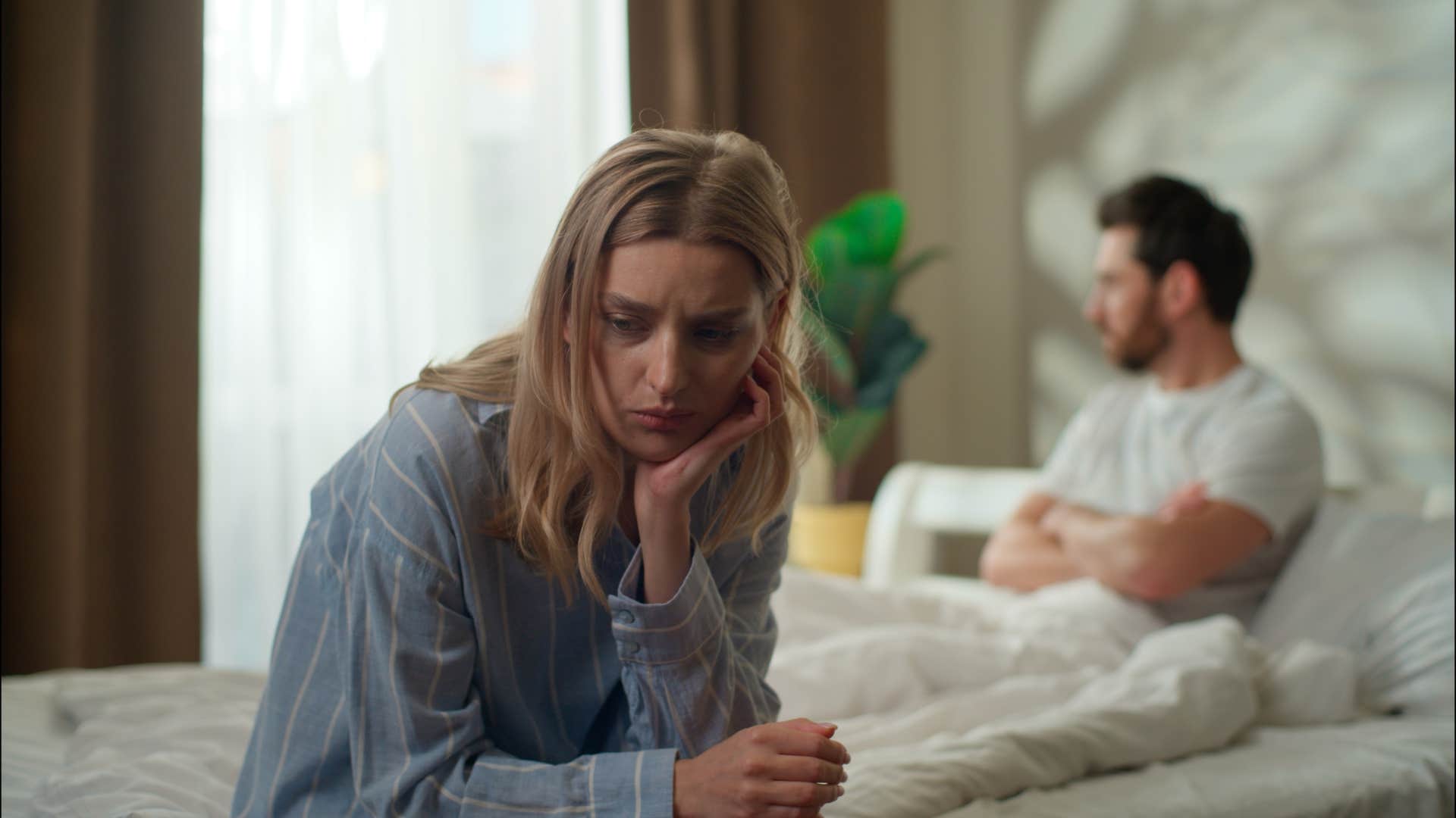 woman not invested in her relationship ignoring man