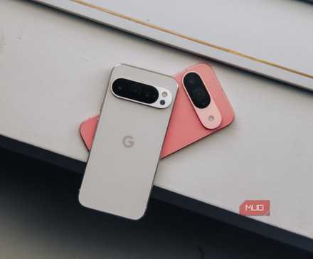 Pixel 9 in pink and 9 Pro in white on white ledge (head on)