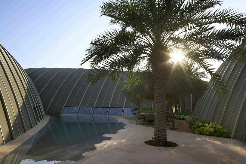 RCR arquitectes' house rises like a blooming structure of ribbed petals in the dubai desert