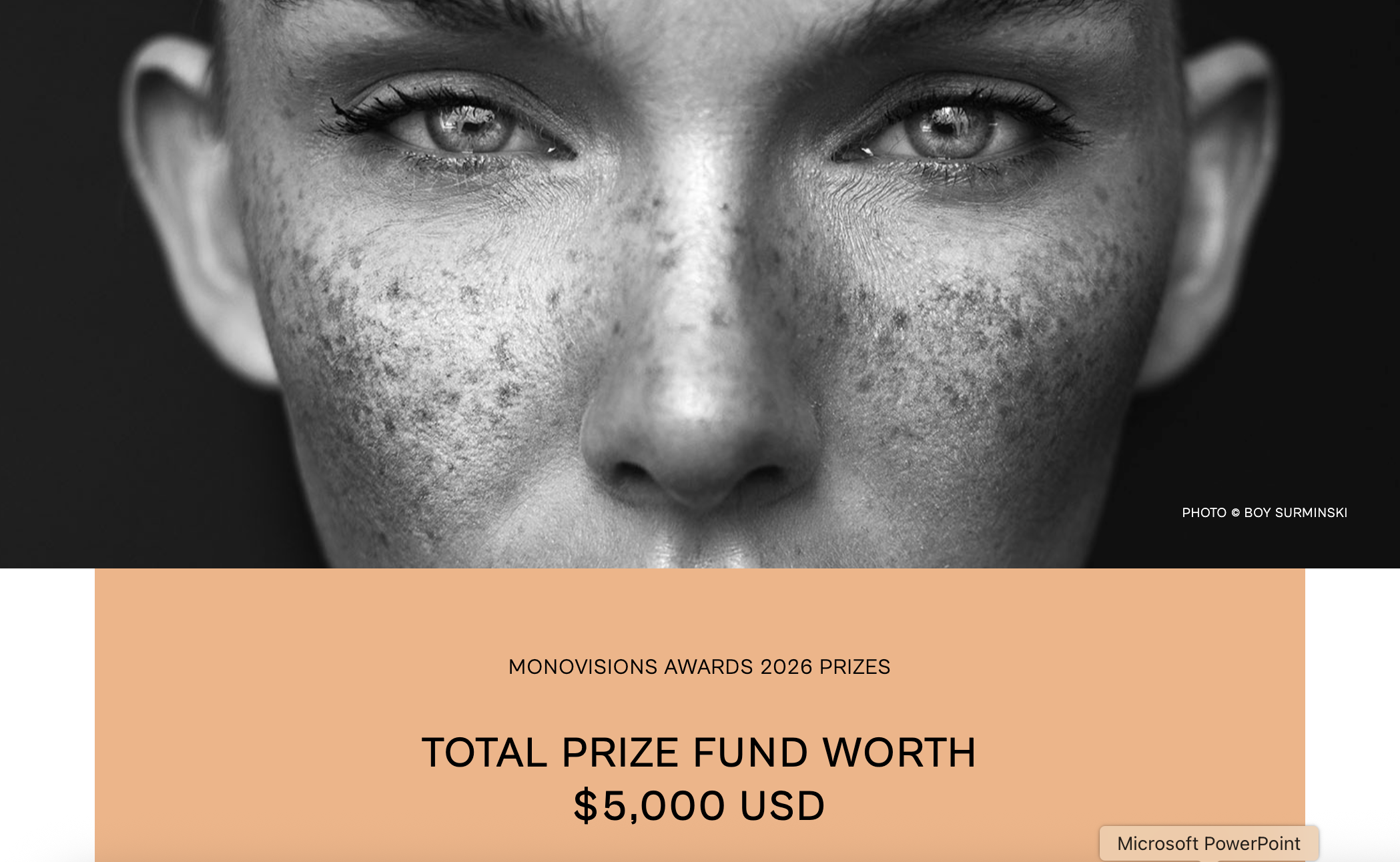 A banner for the Monovisions Awards 2026, featuring a close-up, black-and-white portrait of a woman's freckled face and eyes, with an orange bar below displaying "TOTAL PRIZE FUND WORTH $5,000 USD."