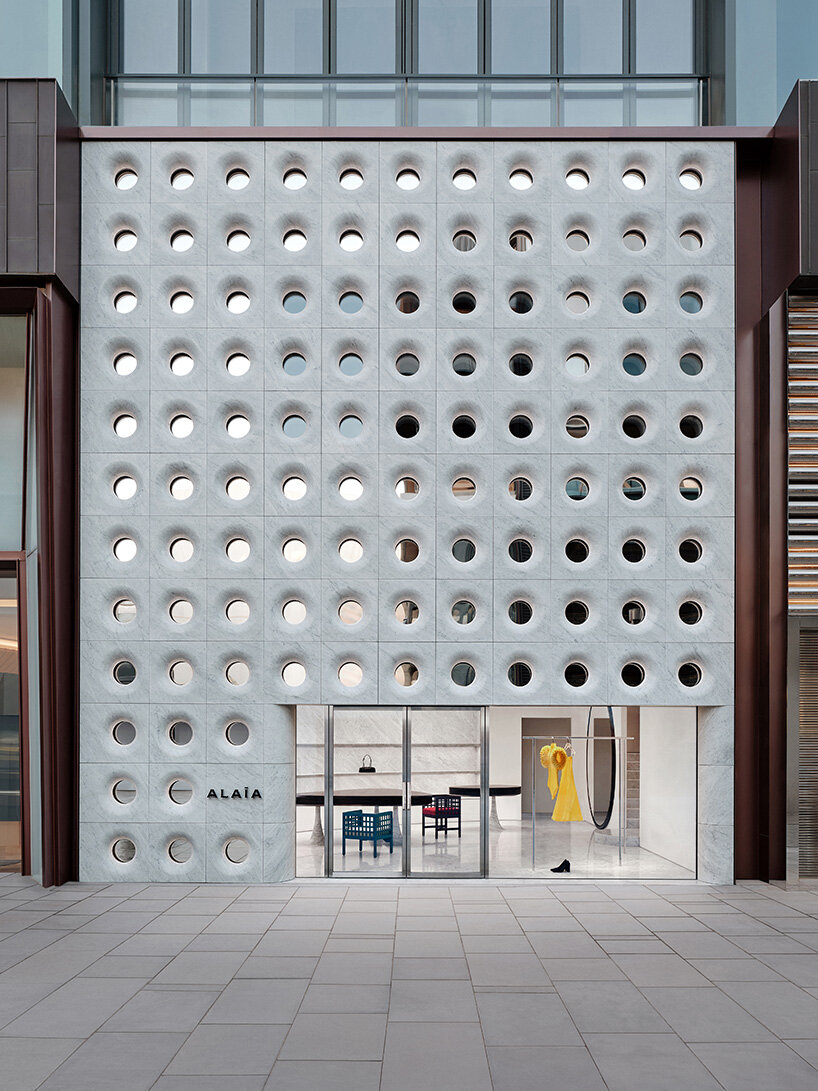 sculptural marble facade by halleroed fronts alaïa's first china flagship in beijing
