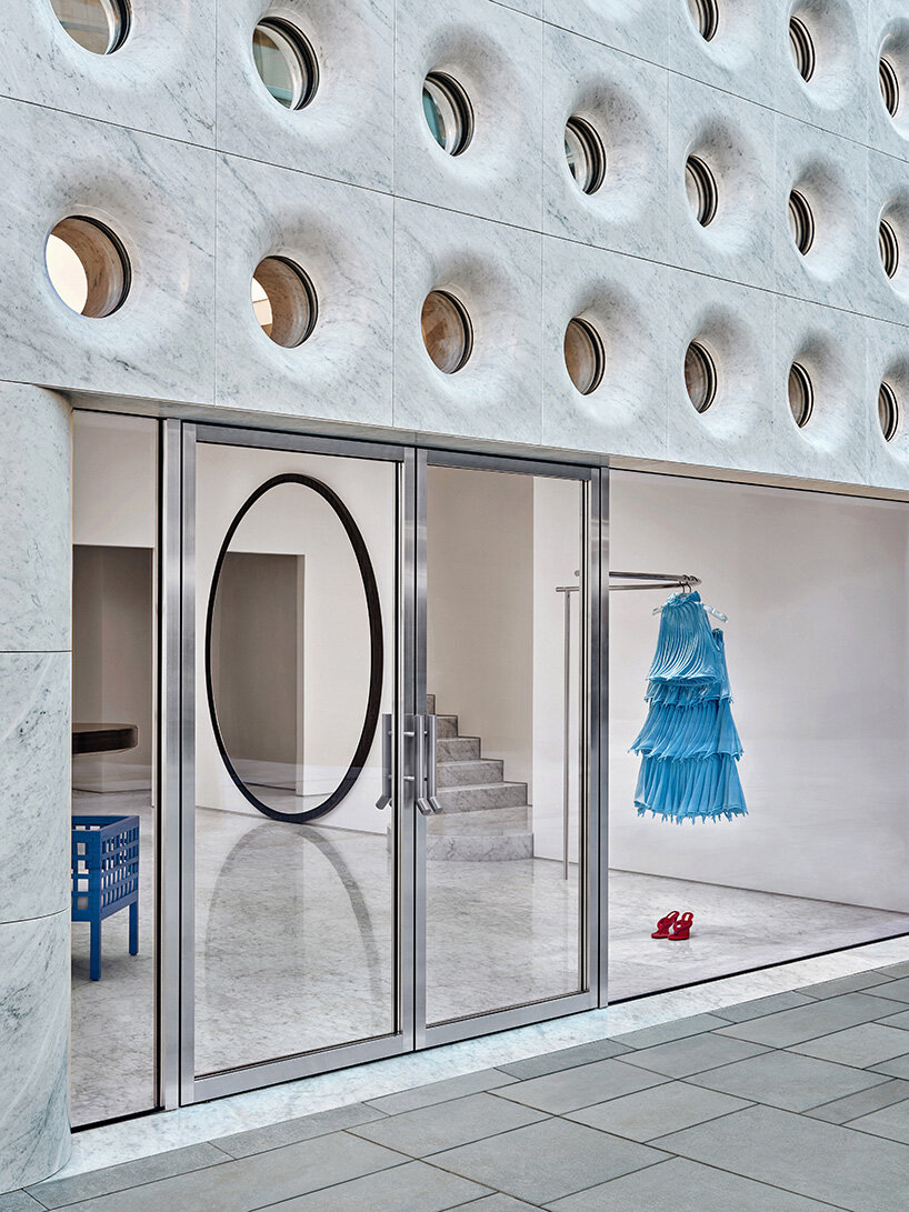 sculptural marble facade by halleroed fronts alaïa's first china flagship in beijing
