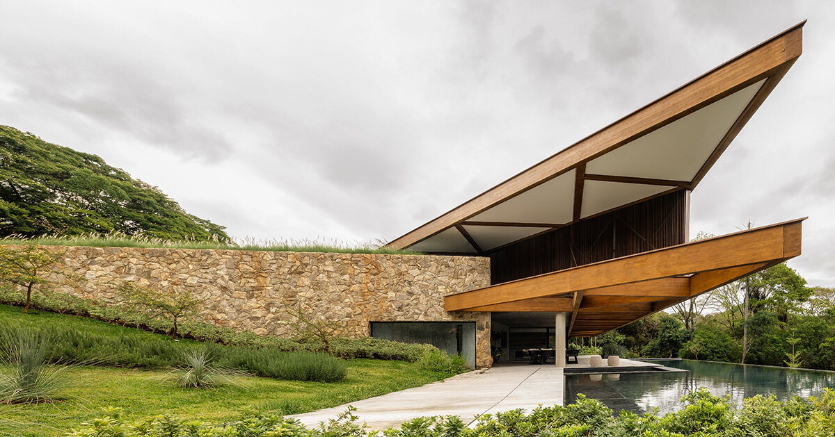 brazilian lakeside house by TETRO hides beneath triangular roof