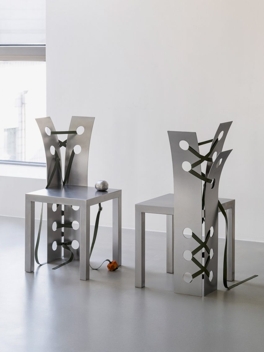 Close-up of two metal chairs