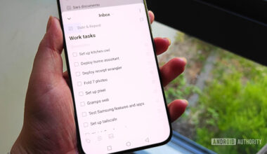 ticktick tasks on a smartphone held in a hand