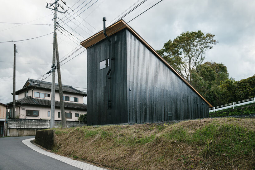 charred cedar facade enfolds kiln-inspired sauna in japan