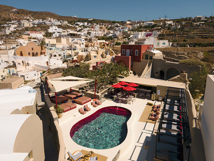 urban soul project redefines the santorini palette through bold red hotel design