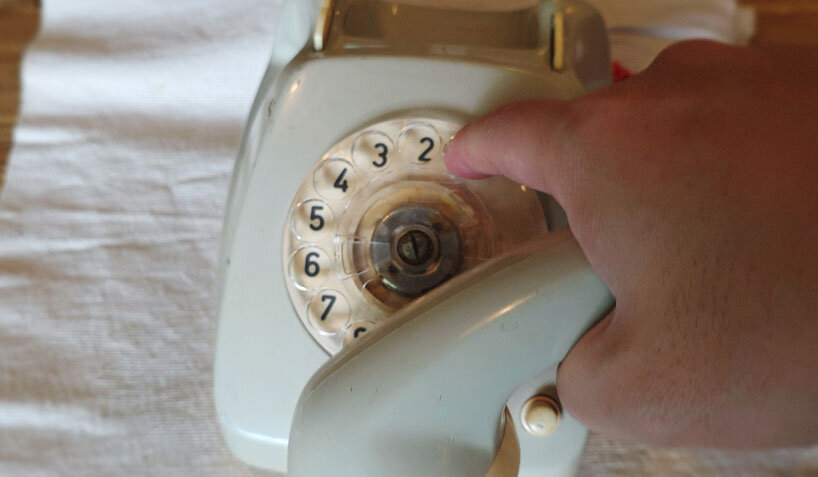 vintage rotary telephone transforms into analog-digital hybrid music player and AI voice chat