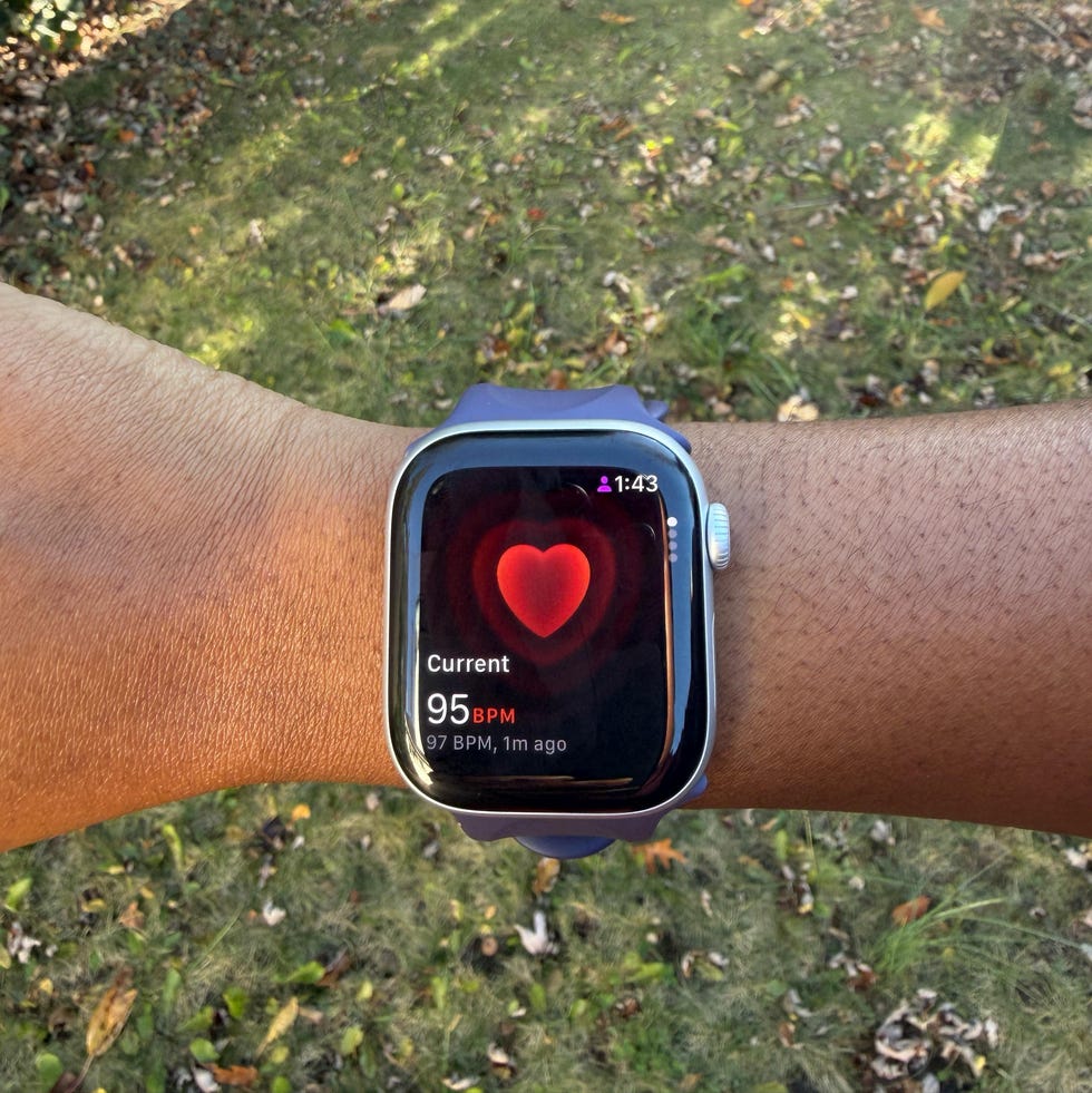 a woman wearing the apple watch series 11 on her wrist