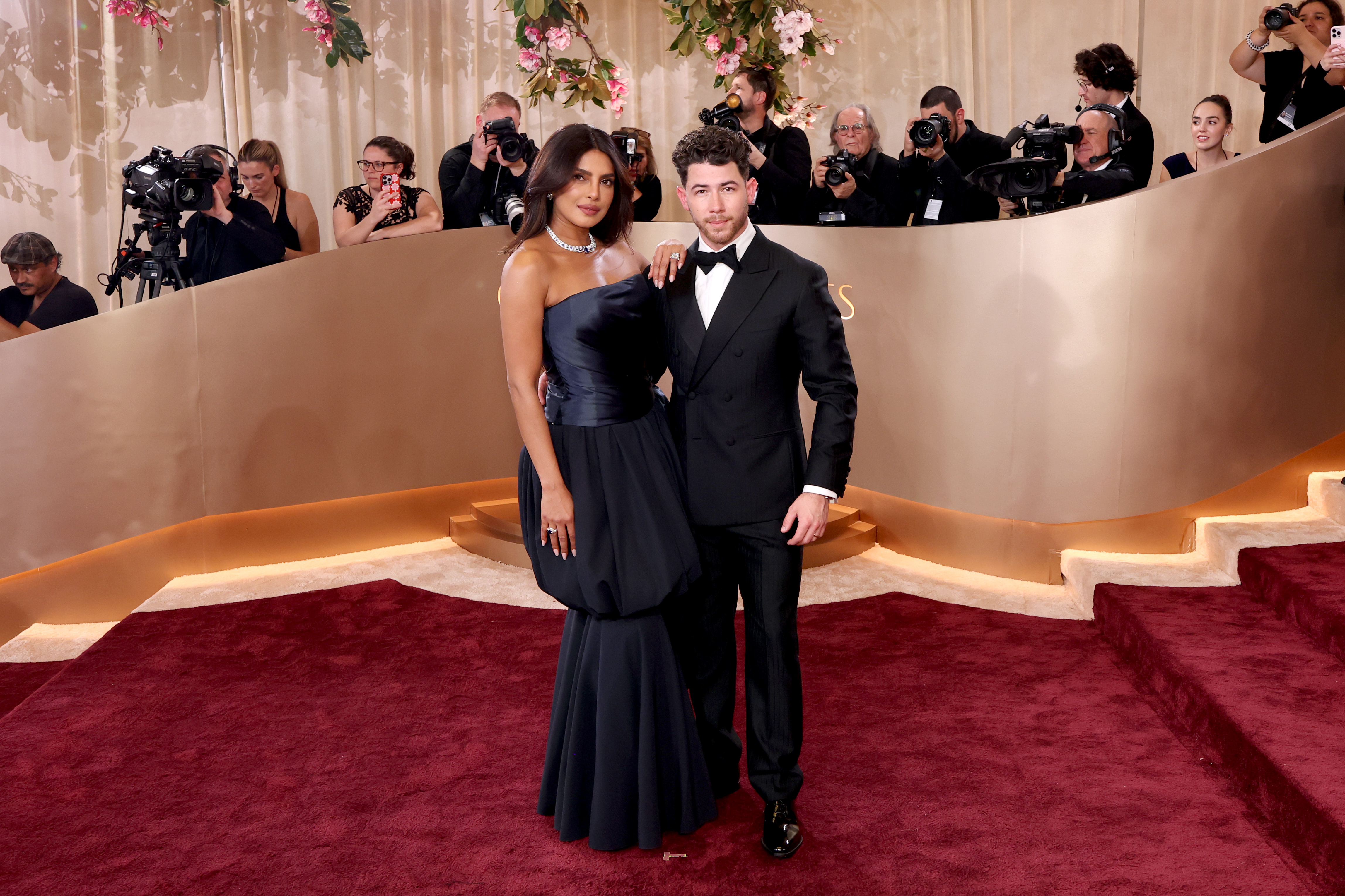 Priyanka Chopra Jonas and Nick Jonas on the red carpet at the 83rd Annual Golden Globe Awards.