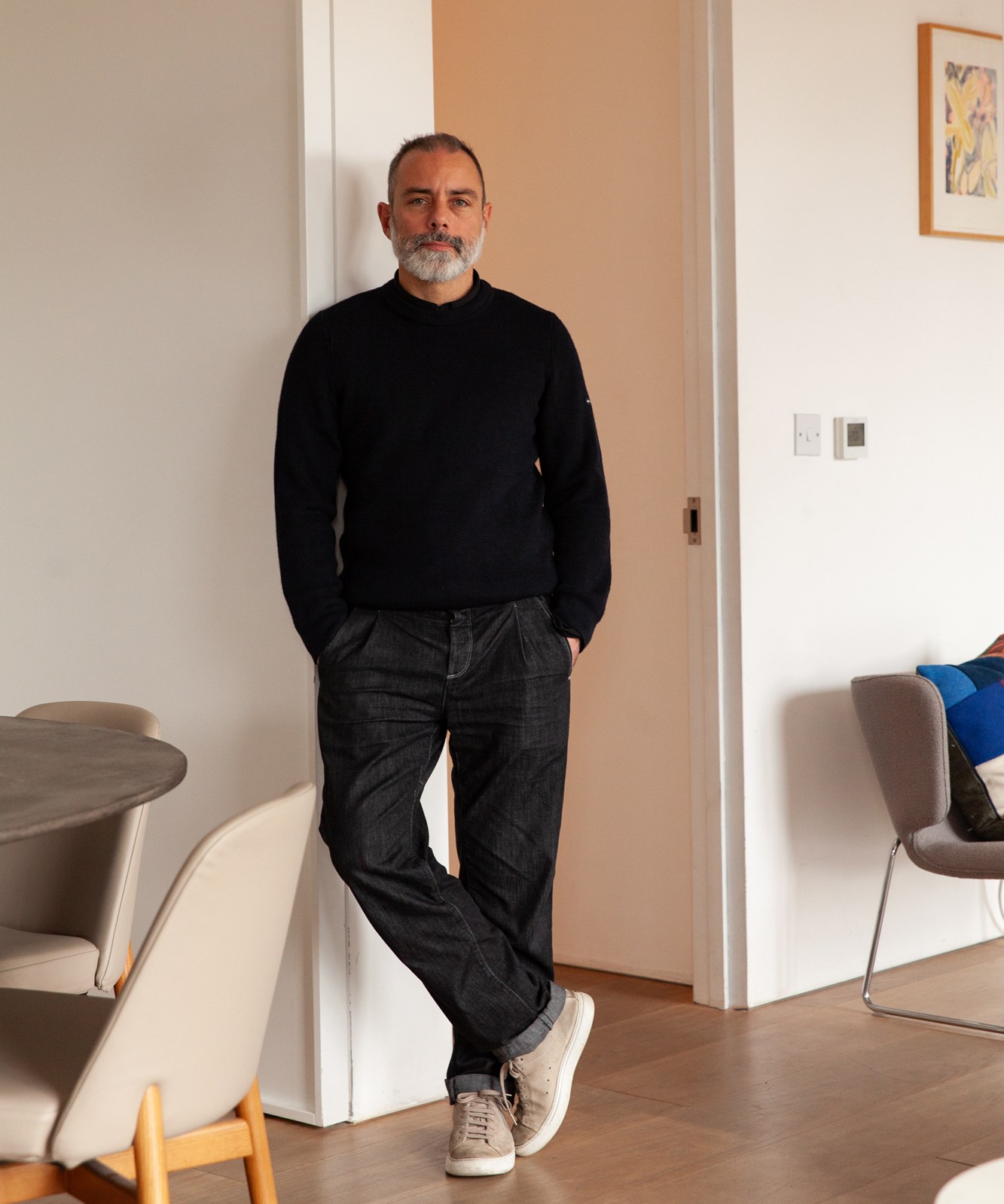 Marc Krusin standing in an interior space.