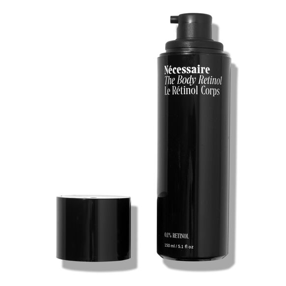 Nécessaire The Body Retinol, Le Rétinol Corps, with 0.1% Retinol, 150 ml/5.1 fl oz, in a black bottle with its cap off.