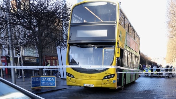 Garda tape can be seen stretching across a Dublin Bus parked on O'Connell Street.