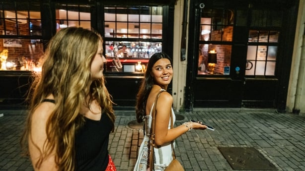 Two young women traveling on backpacking Interrail trip through Europe, arriving and spending time in France. Part of a series with stills