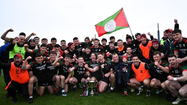 St Brigid's players and staff celebrate winning the 2025 Connacht Championship