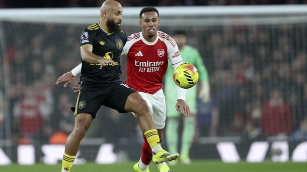 Bryan Mbeumo of Manchester United and Gabriel of Arsenal challenge during the Premier League match between Arsenal and Manchester United at Emirates Stadium on January 25, 2026 in London, England.