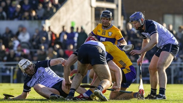 25 January 2026; Dublin and Clare players tussle for the ball during the Allianz Hurling League Division 1B match between Clare and Dublin at Zimmer Biomet Páirc Chíosóg in Ennis, Clare. Photo by John Sheridan/Sportsfile