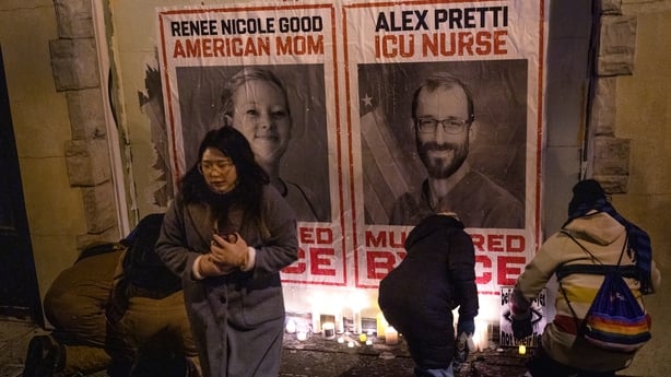 People attend a candlelight vigil