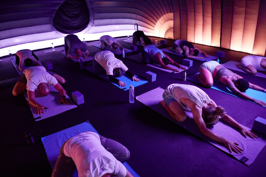 Hotpod Yoga studio class doing child's pose