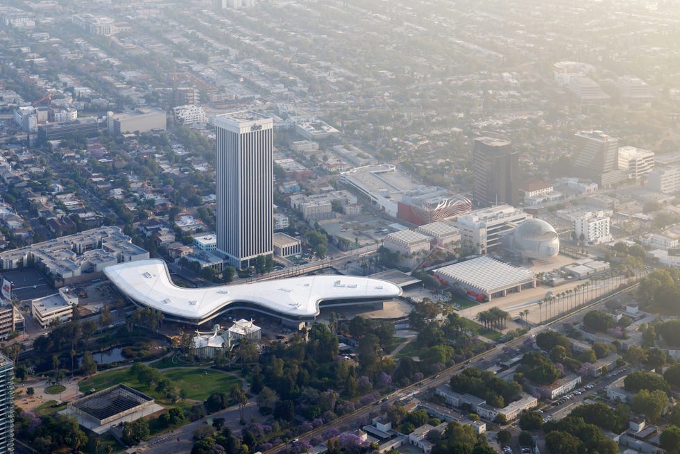Aerial view of an urban area featuring modern architecture and greenery.