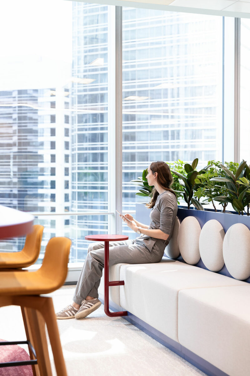 A woman sitting on a bench.