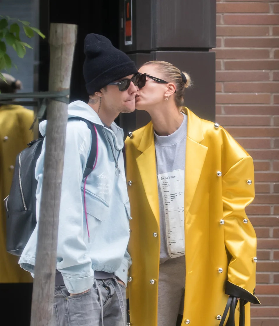 Justin and Hailey kissing outdoors