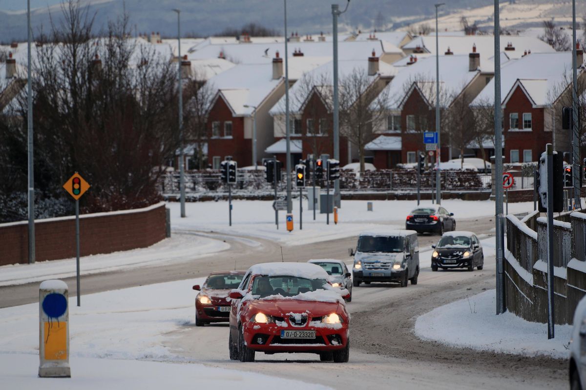 28/02/18 - Commuters make their way in the snow in Lucan, Co Dublin during the 'Beast from the East'