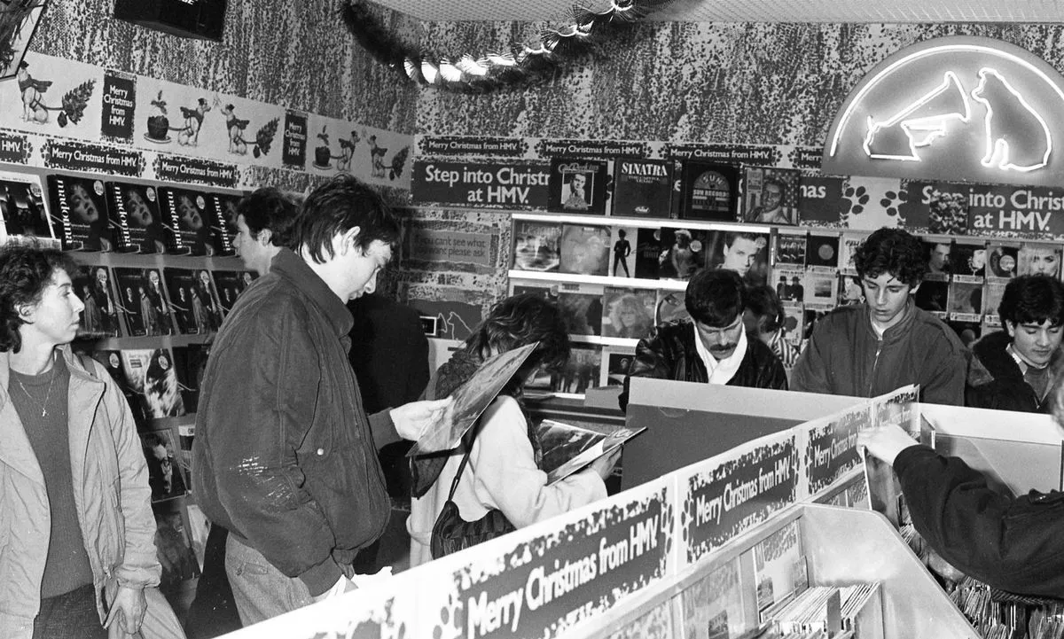 A black and white photo of customers browsing at the opening of the HMV Megastore on Grafton St. Dublin  8/12/1986